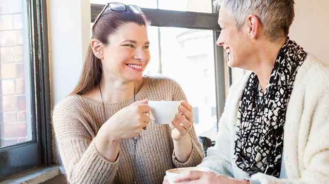 How to combat loneliness: two women talking with a cup of tea